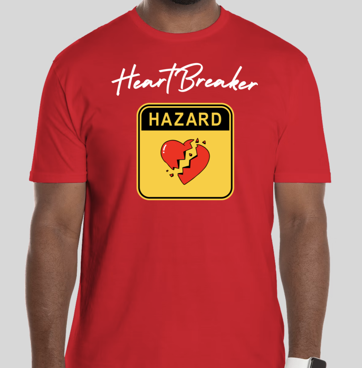 The Heart Breaker t-shirt features the phrase heart breaker written in cursive script. Underneath the script is a hazard symbol with the BHS heart in the middle of the hazard sign. The slim BHS logo has been applied to the back of the t-shirt.